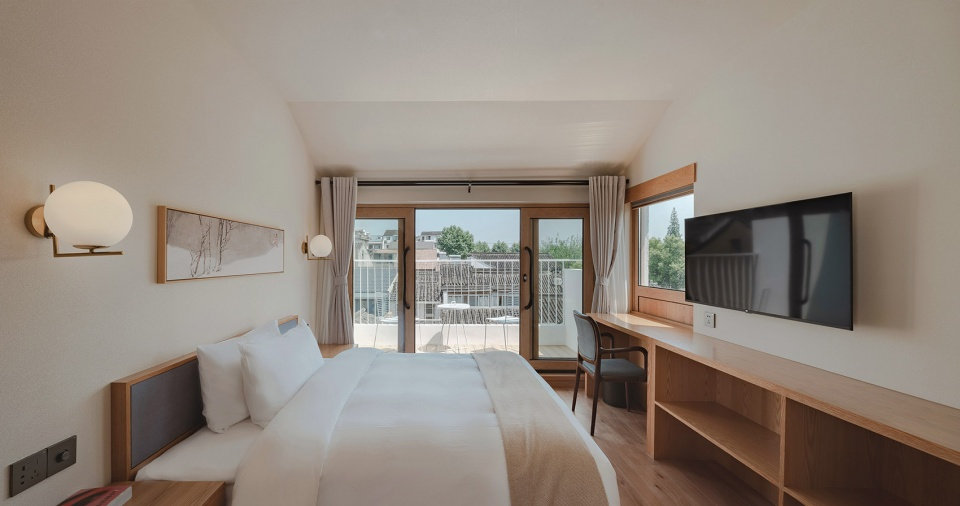 郑州旧房改民宿装修-花里精品民宿开云中国装修实景图