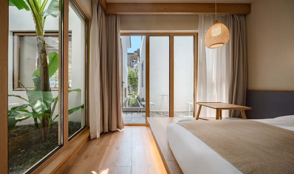 郑州旧房改民宿装修-花里精品民宿开云中国装修实景图